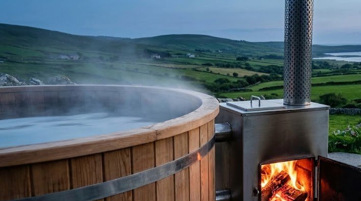 External wood burning stove heating a wood fired hot tub in the Irish countryside